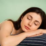 Can sleeping on your stomach cause headaches?