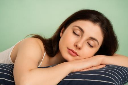 Can sleeping on your stomach cause headaches?