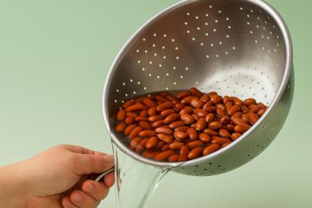 What should you do with the water in which you cooked beans?