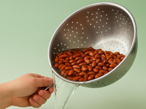 What should you do with the water in which you cooked beans?
